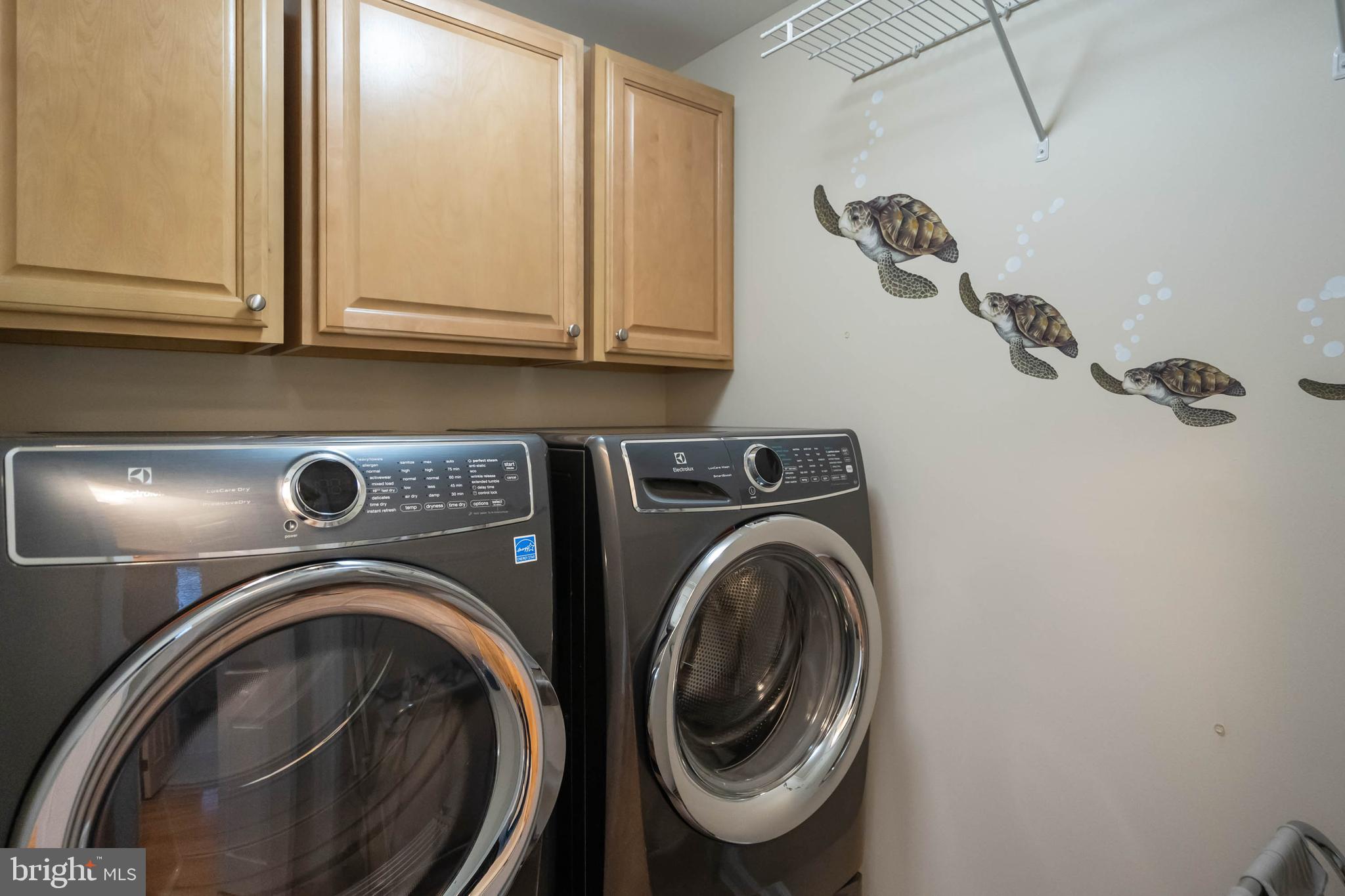 32876 Ocean Reach Lewes, DE 19958 - Photo 42 of 68 a view of storage and utility room with washer and dryer