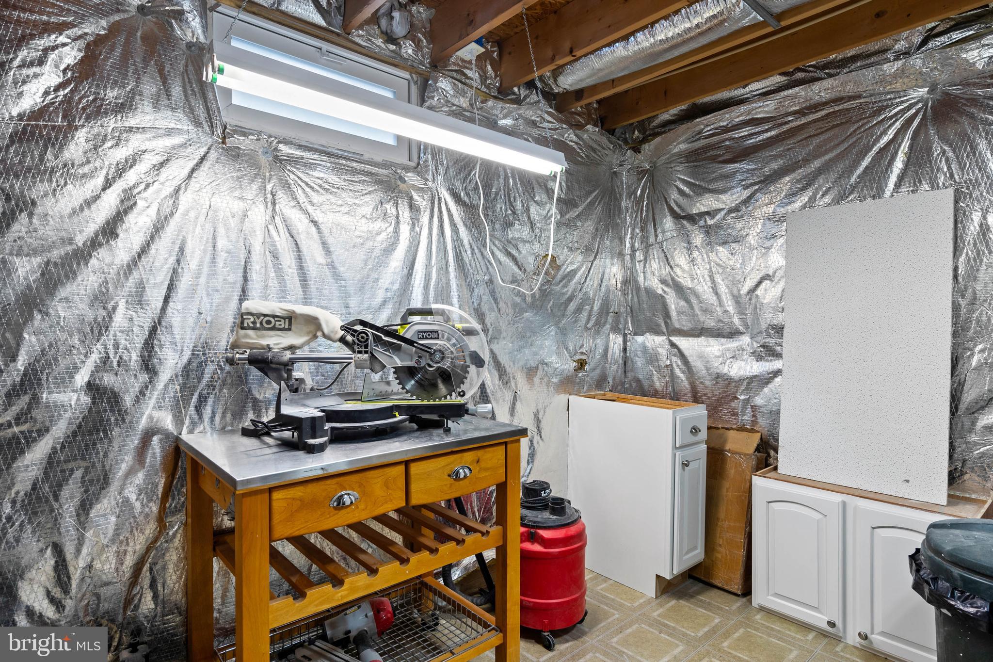 32876 Ocean Reach Lewes, DE 19958 - Photo 52 of 68 a view of walk in closet with clothes and shoes