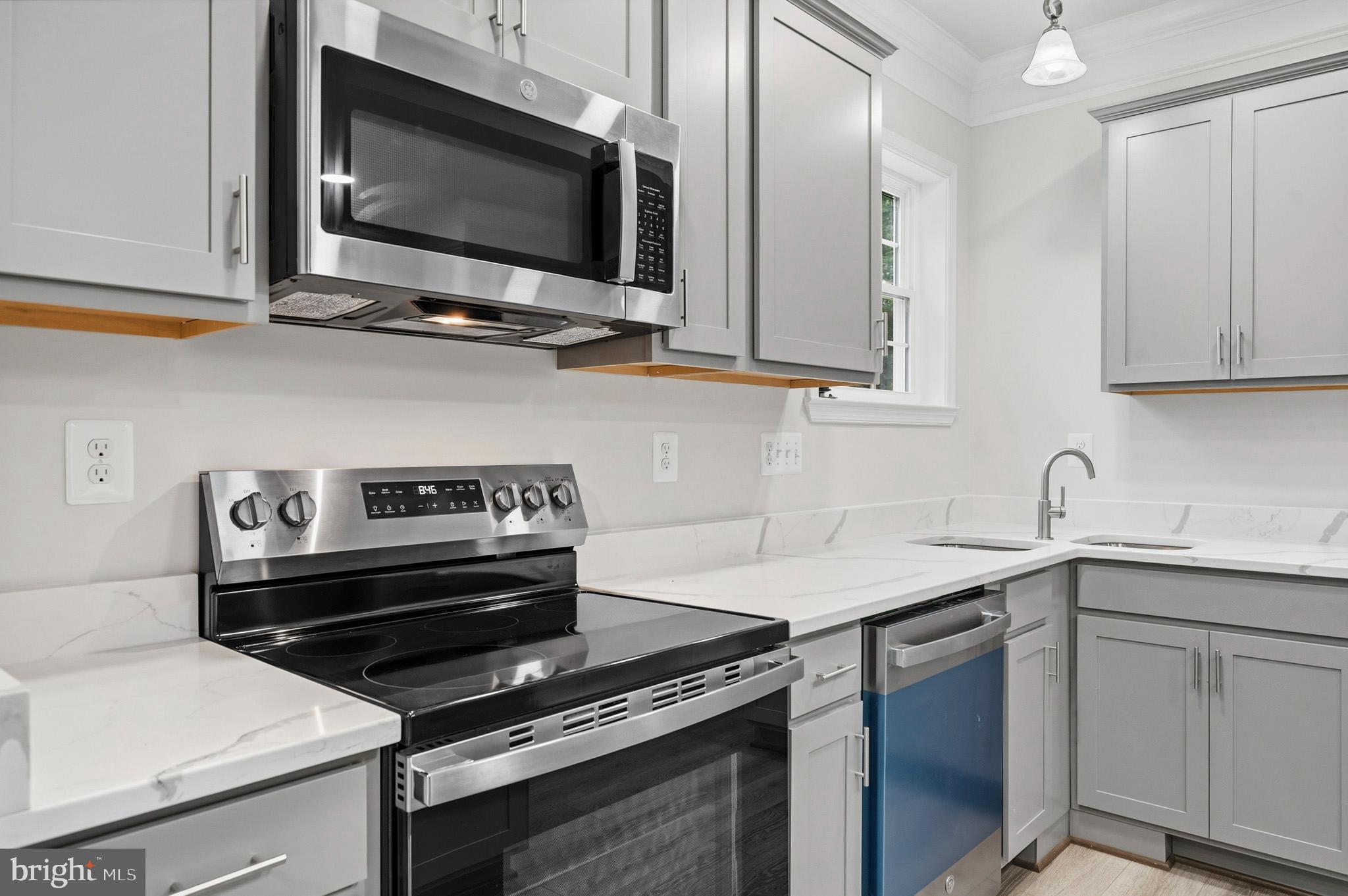 29725 Bruce Road Mechanicsville, MD 20659 - Photo 50 of 79 a kitchen with a stove and a microwave