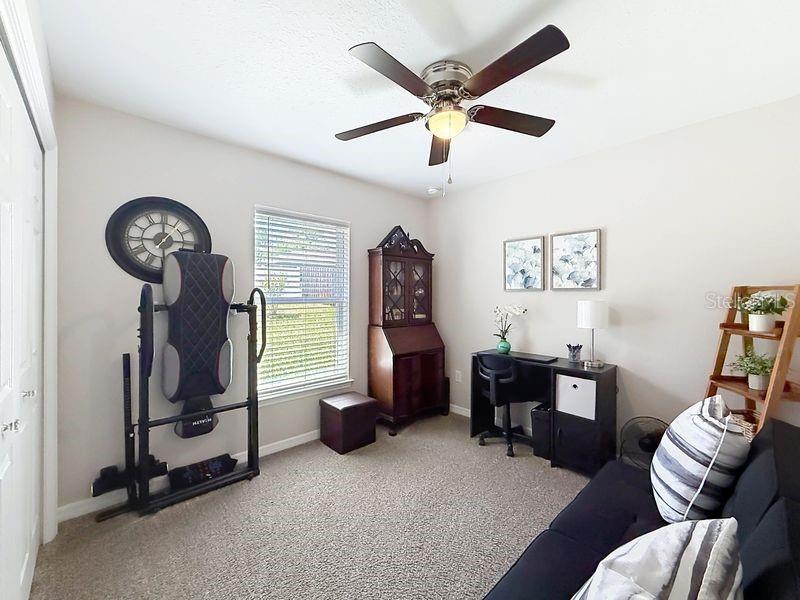 20156 Southwest 83rd Place Dunnellon, FL 34431 - Photo 11 of 28 a view of a livingroom with furniture and a ceiling fan