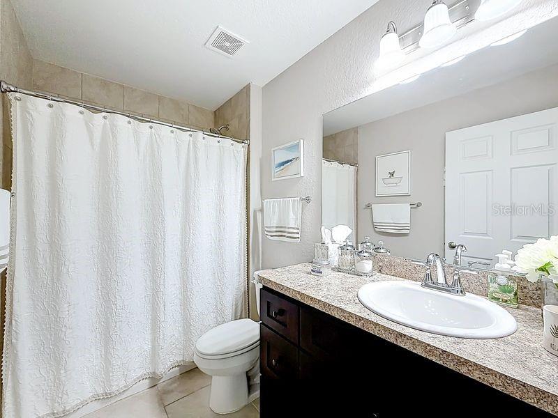 20156 Southwest 83rd Place Dunnellon, FL 34431 - Photo 15 of 28 a bathroom with a double vanity sink toilet and a mirror