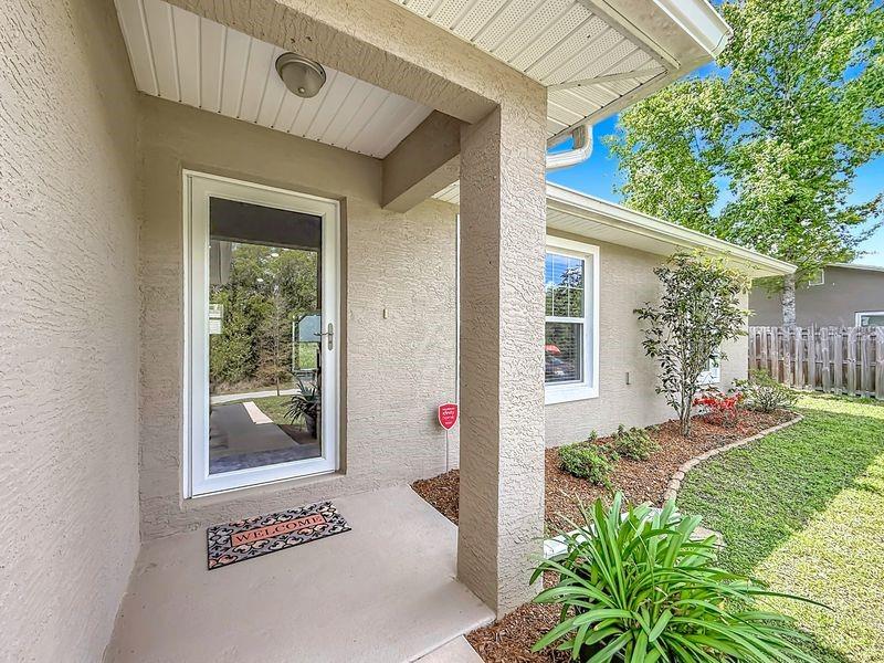 20156 Southwest 83rd Place Dunnellon, FL 34431 - Photo 3 of 28 a front view of a house with garden