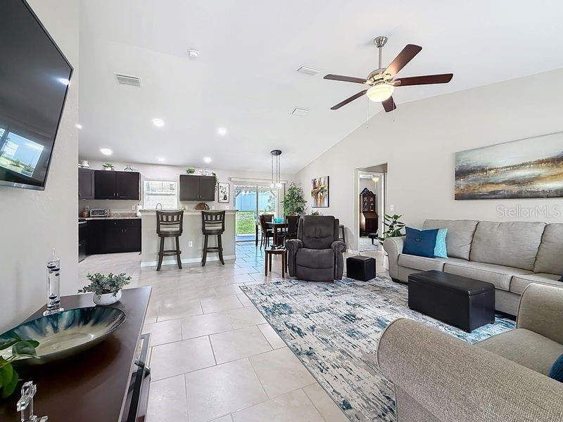 20156 Southwest 83rd Place Dunnellon, FL 34431 - Photo 4 of 28 a living room with furniture and a flat screen tv