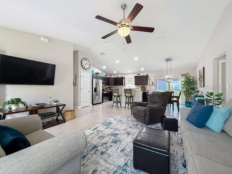 20156 Southwest 83rd Place Dunnellon, FL 34431 - Photo 5 of 28 a living room with furniture and a flat screen tv