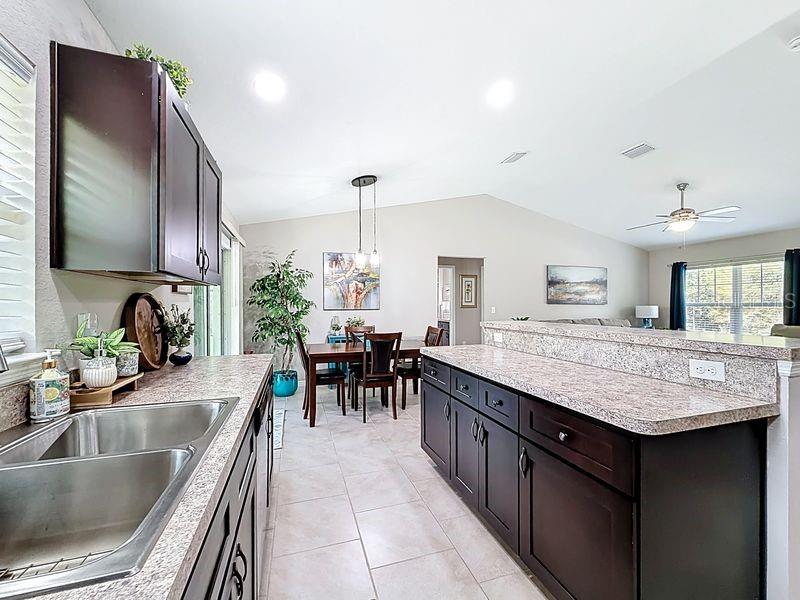 20156 Southwest 83rd Place Dunnellon, FL 34431 - Photo 9 of 28 a kitchen with center island table and chairs