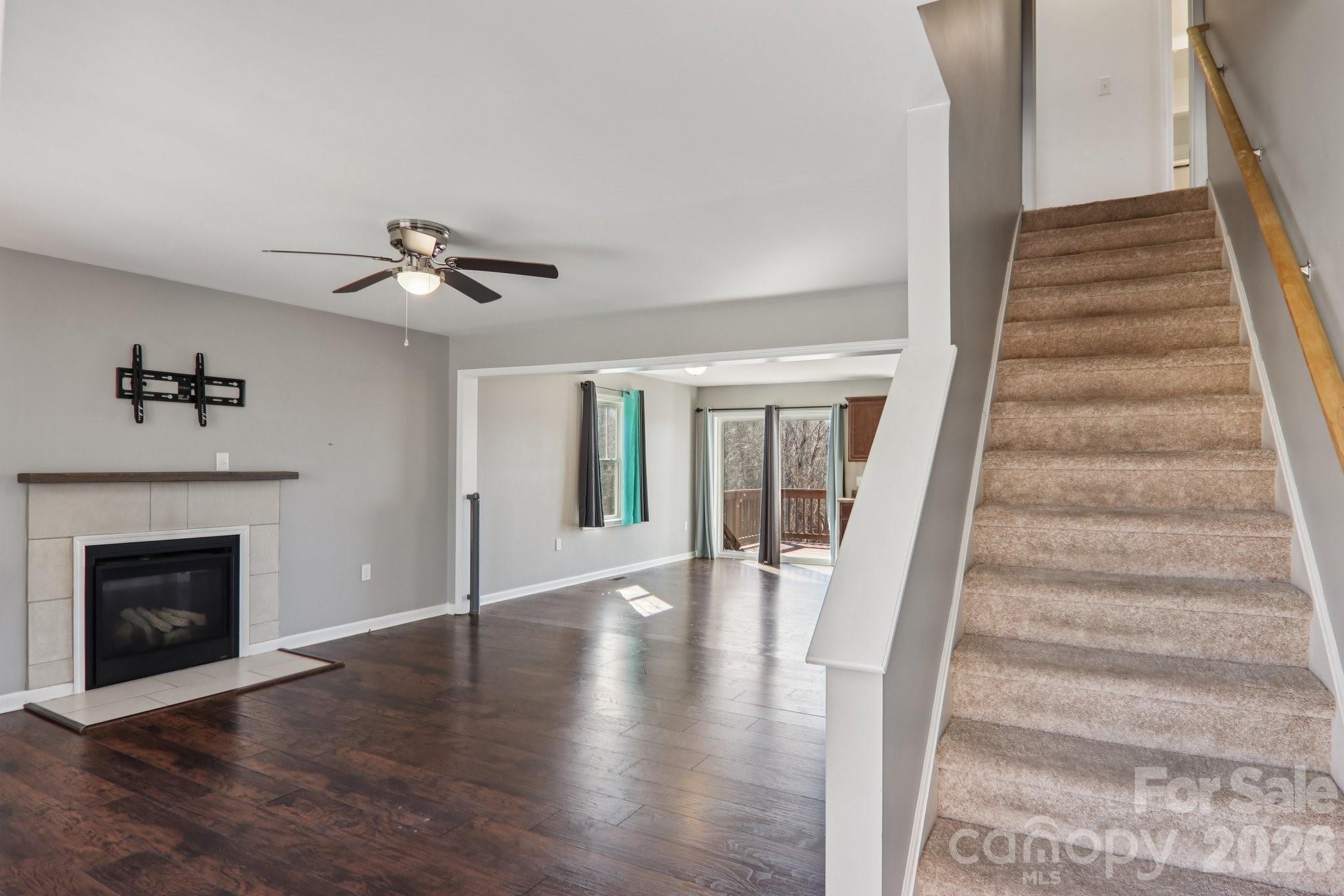 751 Hutch Mountain Road Fletcher, NC 28732 - Photo 6 of 48 a view of an entryway with wooden floor and a fireplace