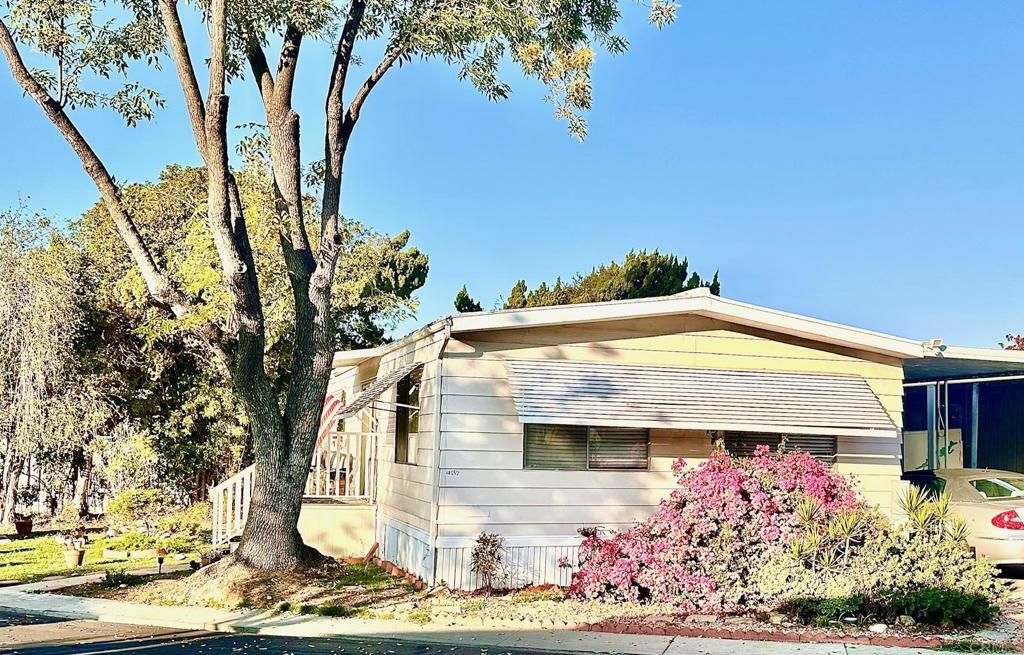 4812 Old Cliffs Road San Diego, CA 92120 - Photo 4 of 11 a front view of a house with a yard