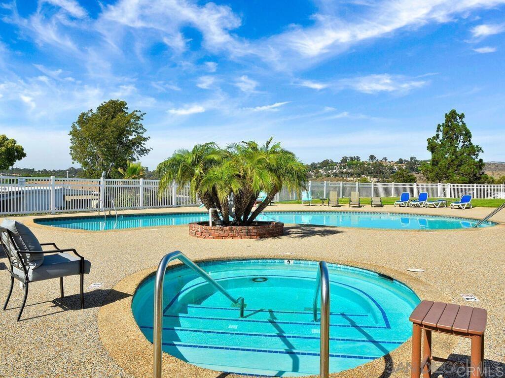 4812 Old Cliffs Road San Diego, CA 92120 - Photo 6 of 11 a view of a swimming pool with a patio and a yard