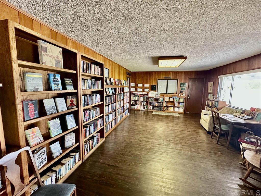 4812 Old Cliffs Road San Diego, CA 92120 - Photo 10 of 11 a living room with furniture and a book shelf
