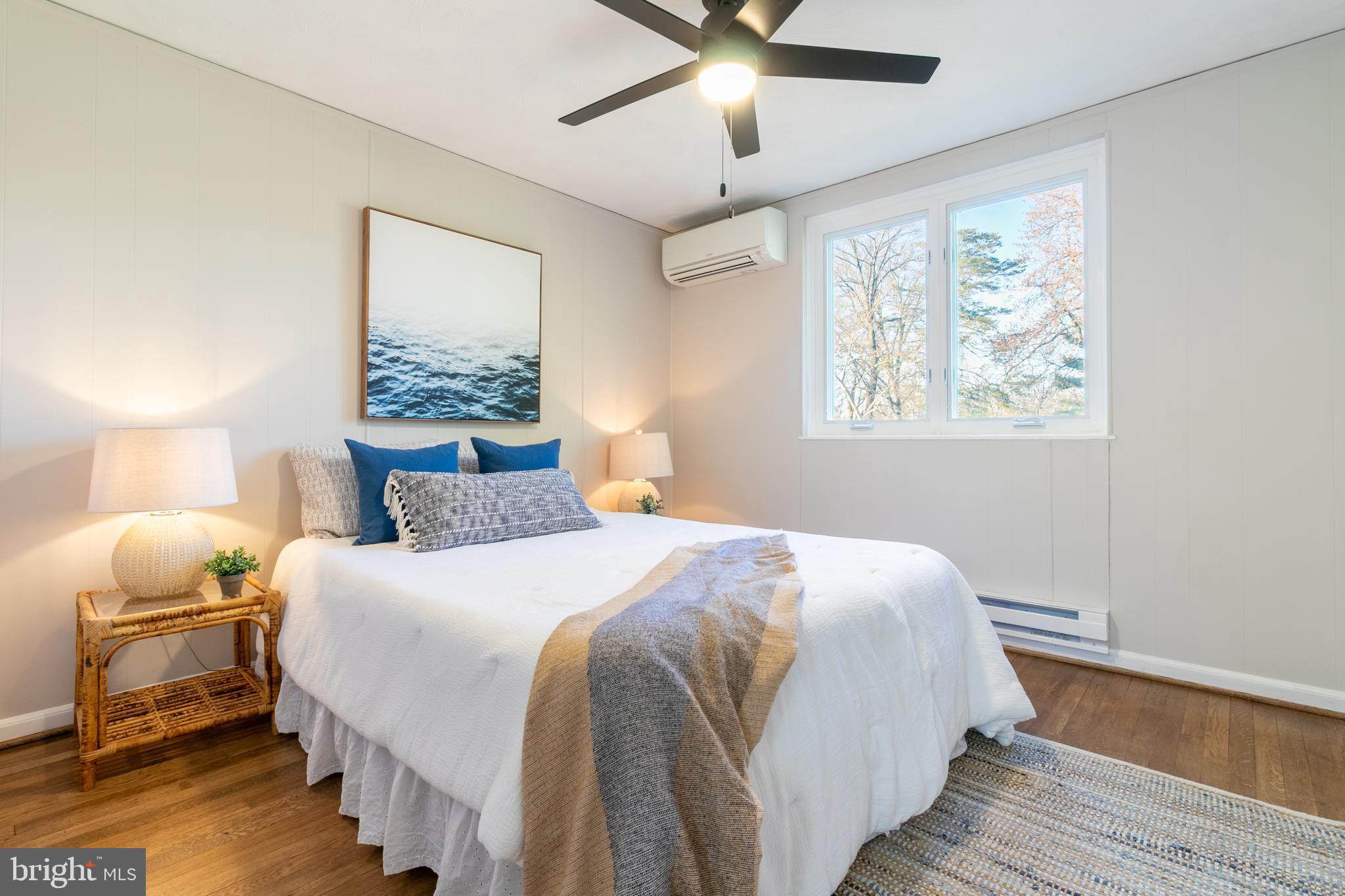 45 Ridge Road Greenbelt, MD 20770 - Photo 26 of 33 a bedroom with a bed and wooden floor