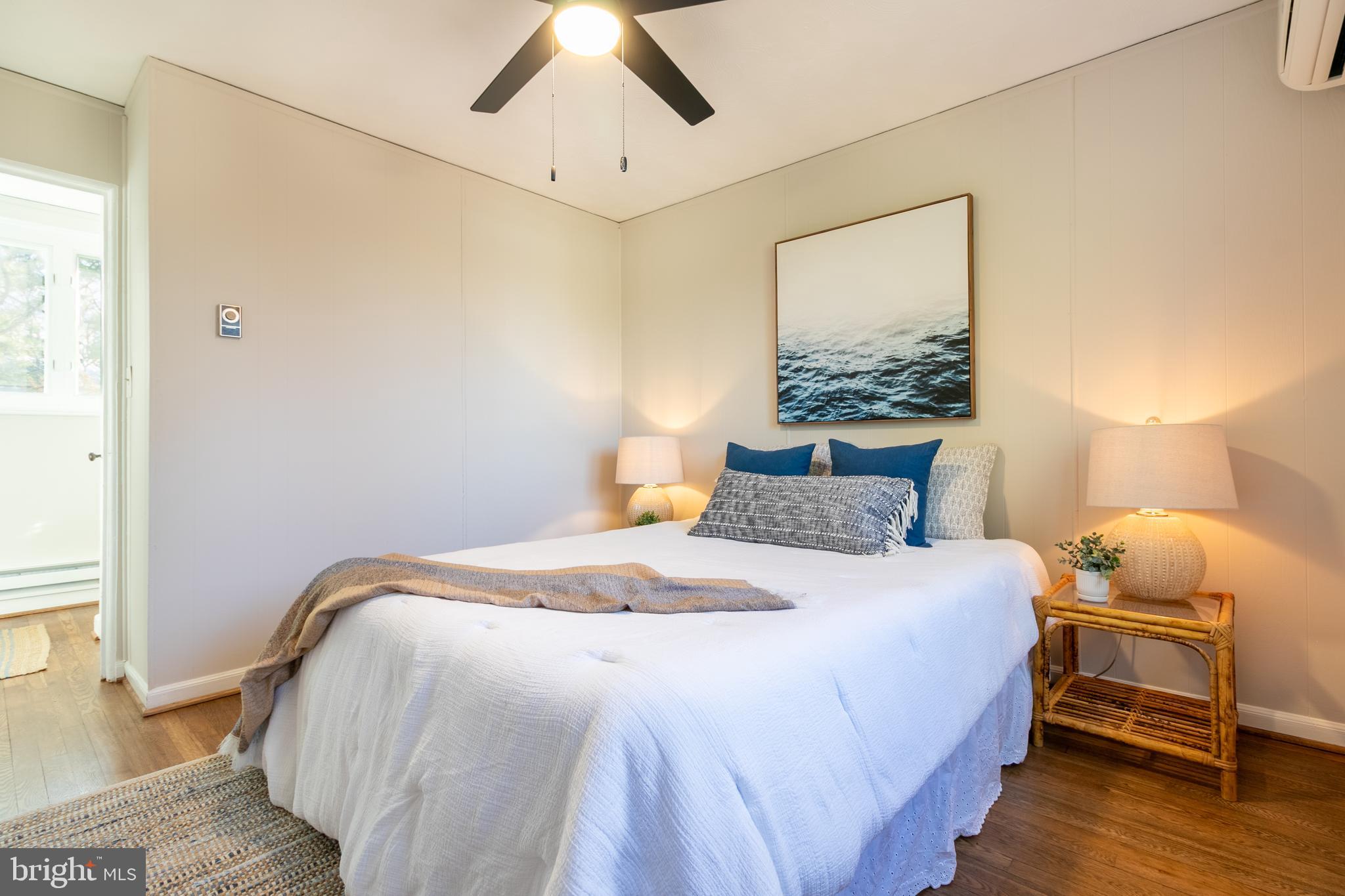 45 Ridge Road Greenbelt, MD 20770 - Photo 27 of 33 a bedroom with a bed and wooden floor