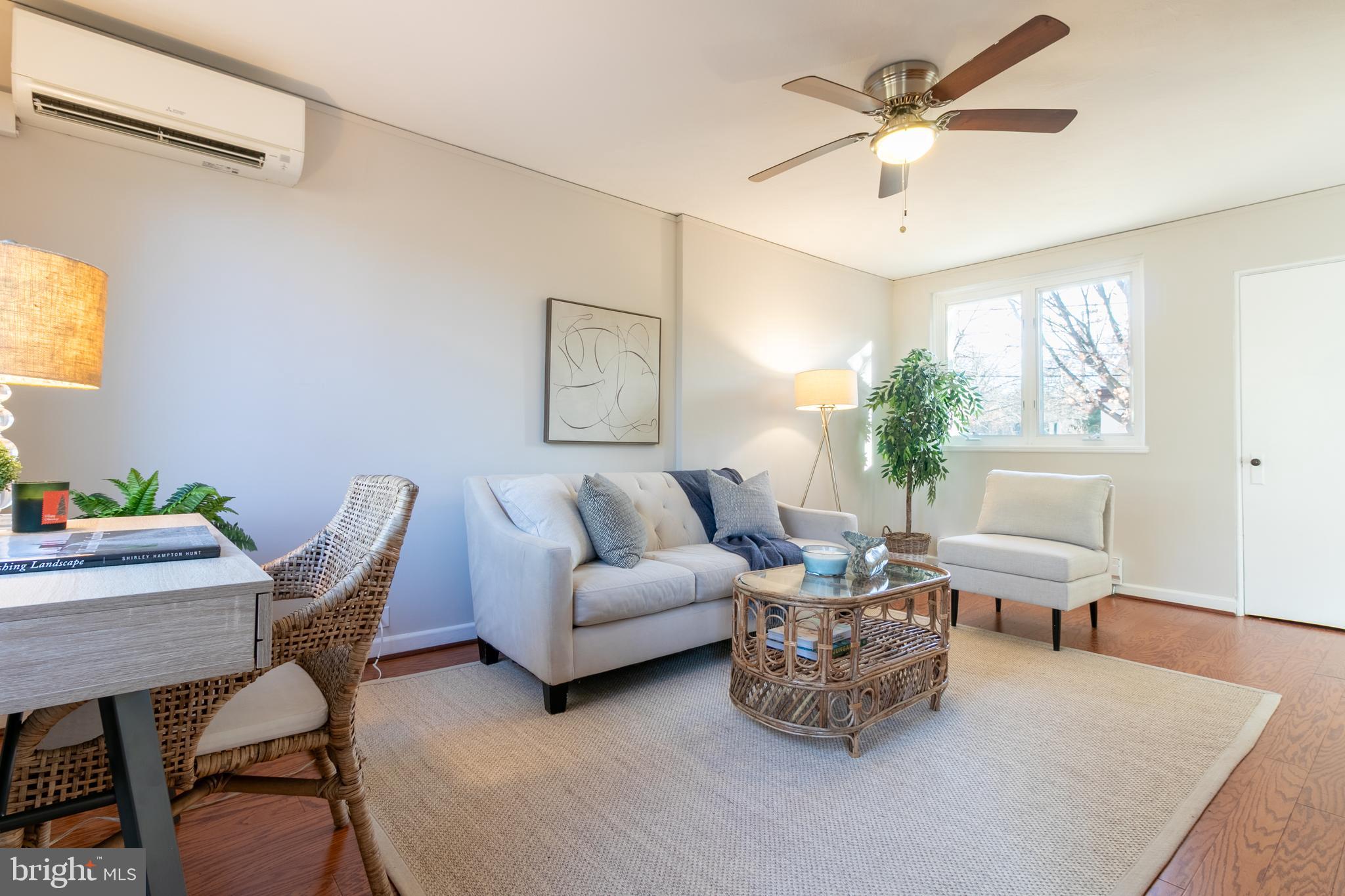 45 Ridge Road Greenbelt, MD 20770 - Photo 5 of 33 a living room with furniture and a large window