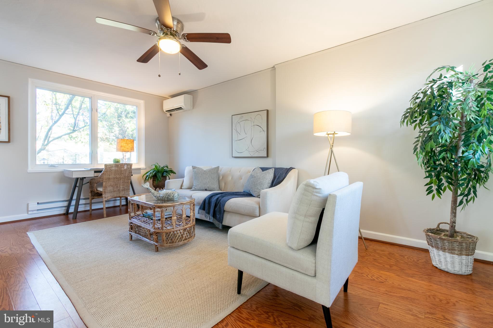 45 Ridge Road Greenbelt, MD 20770 - Photo 7 of 33 a living room with furniture potted plant and a window