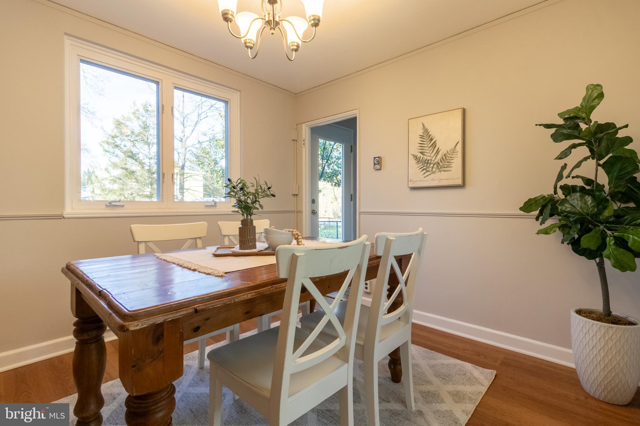 45 Ridge Road Greenbelt, MD 20770 - Photo 9 of 33 a view of a dining room with furniture window and wooden floor