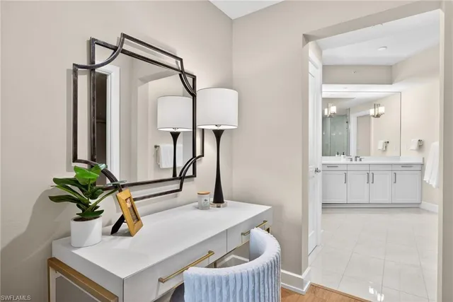 a bedroom with a large bed and a couch