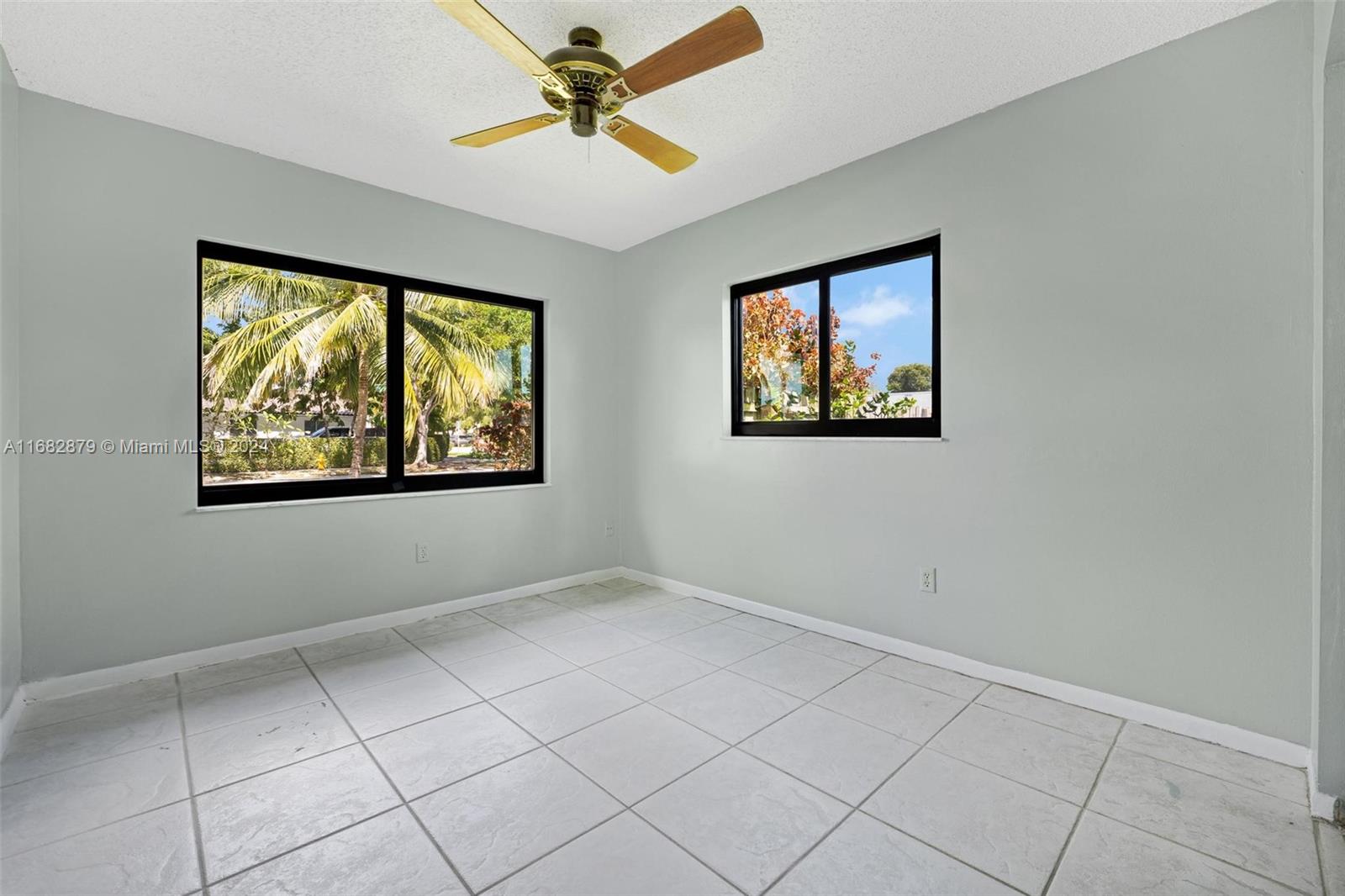 14006 Southwest 48th Terrace Miami, FL 33175 - Photo 11 of 24 a view of an empty room with a window