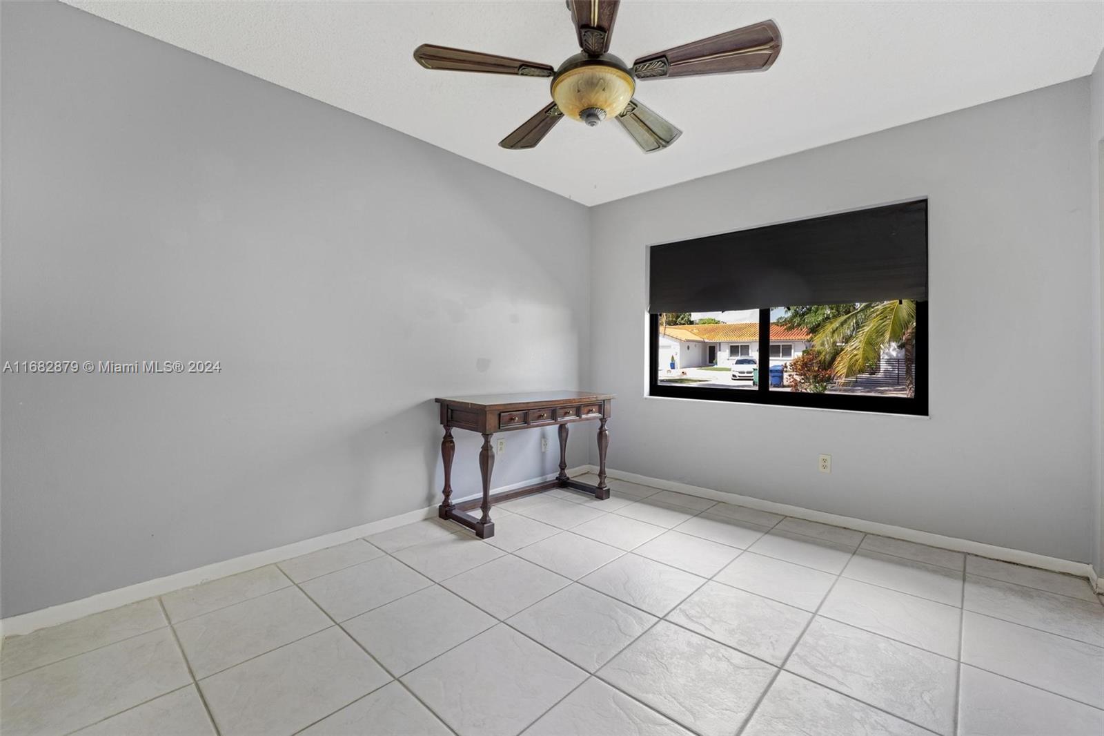 14006 Southwest 48th Terrace Miami, FL 33175 - Photo 12 of 24 a living room with projector and a flat screen tv