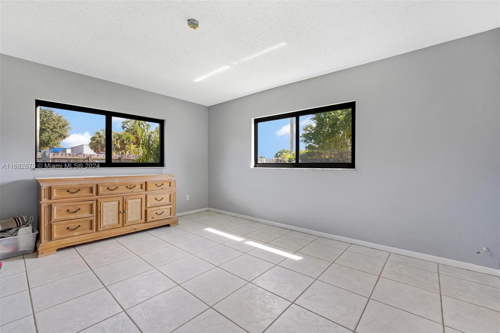 14006 Southwest 48th Terrace Miami, FL 33175 - Photo 13 of 24 a view of a livingroom with furniture and window