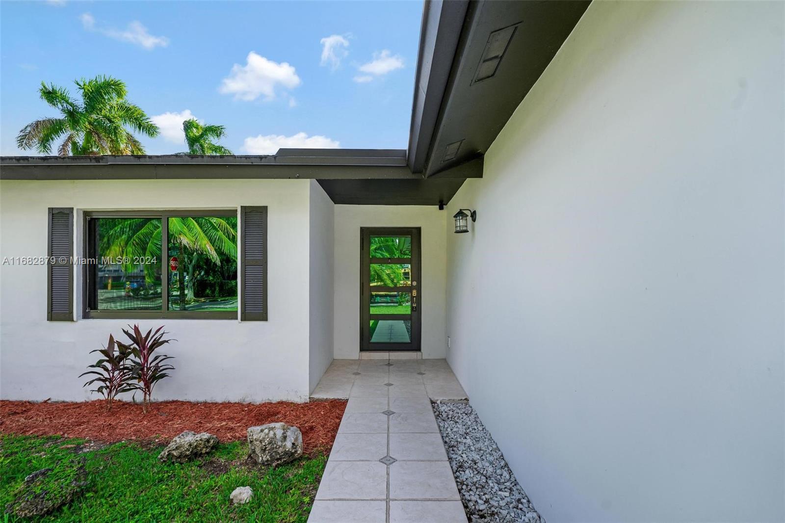 14006 Southwest 48th Terrace Miami, FL 33175 - Photo 17 of 24 a view of a porch with a table and chairs