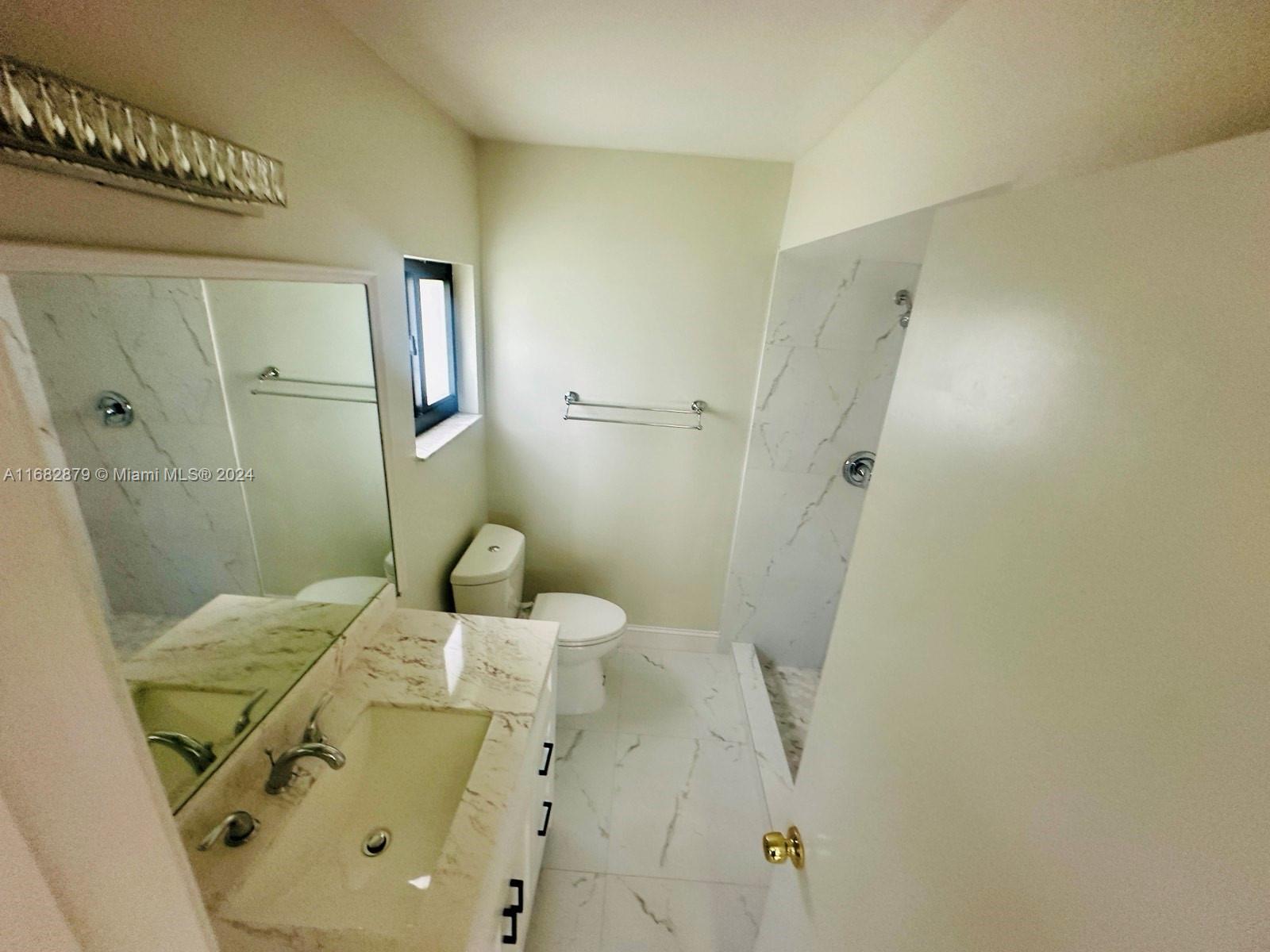 14006 Southwest 48th Terrace Miami, FL 33175 - Photo 6 of 24 a bathroom with a sink and shower