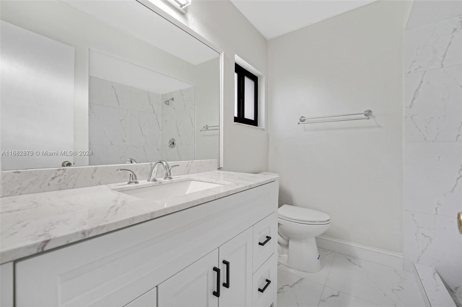 14006 Southwest 48th Terrace Miami, FL 33175 - Photo 8 of 24 a bathroom with a granite countertop sink and a toilet