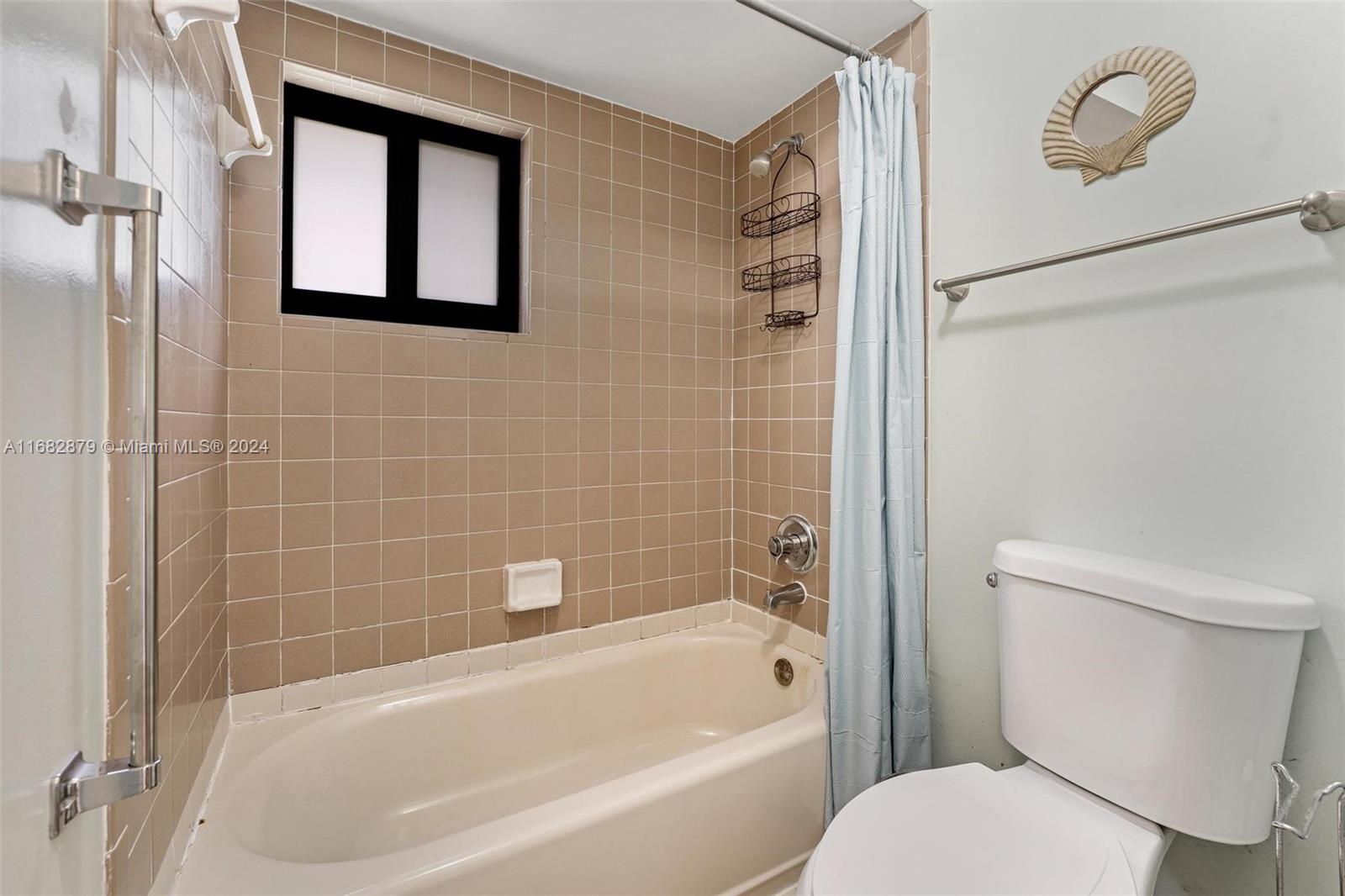 14006 Southwest 48th Terrace Miami, FL 33175 - Photo 10 of 24 a bathroom with a toilet and a bathtub