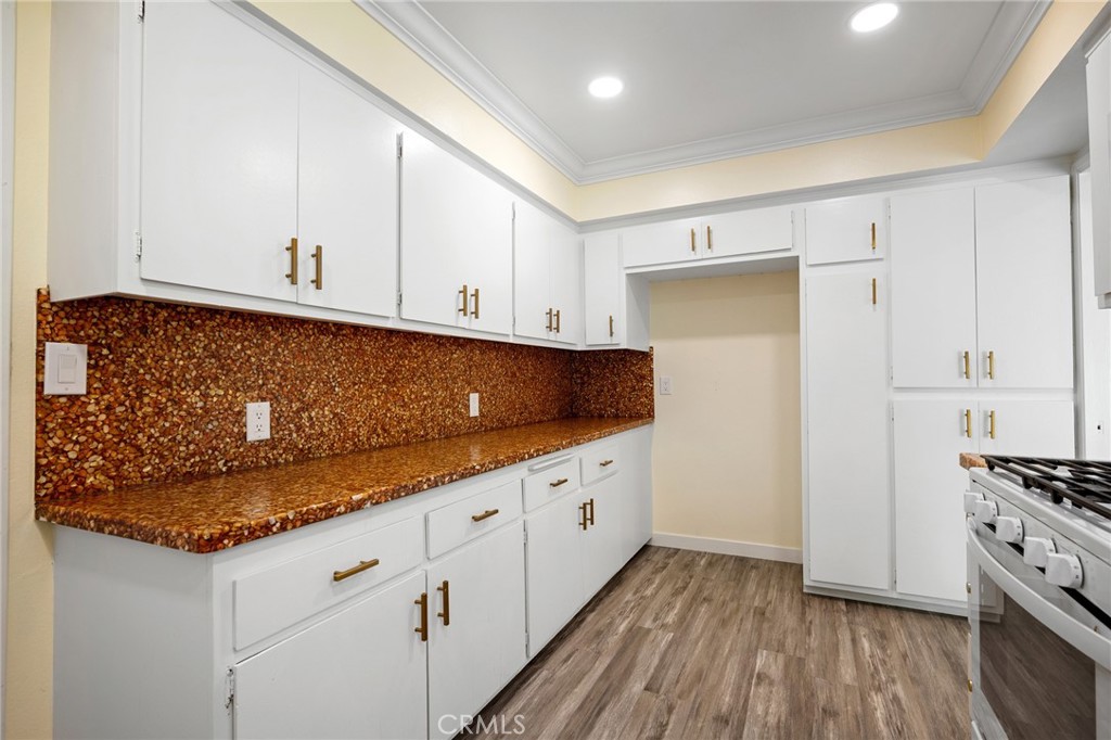 575 Winona Way Pasadena, CA 91103 - Photo 11 of 29 a kitchen with granite countertop white cabinets and stainless steel appliances