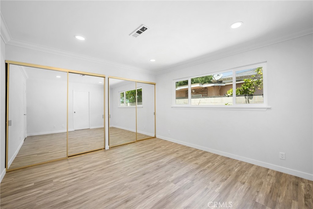575 Winona Way Pasadena, CA 91103 - Photo 13 of 29 wooden floor in an empty room with a window