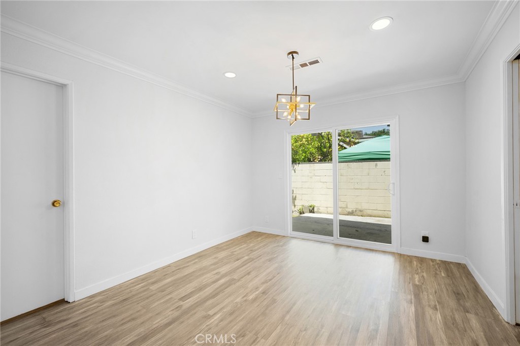 575 Winona Way Pasadena, CA 91103 - Photo 8 of 29 an empty room with wooden floor and windows
