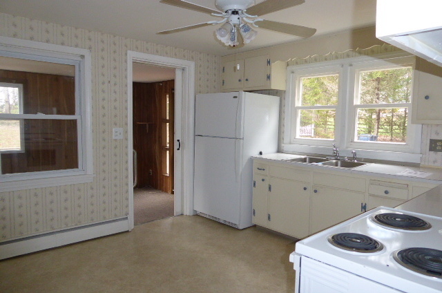 21 Schroback Road Plymouth, CT 06782 - Photo 5 of 22 a kitchen with a refrigerator and a sink