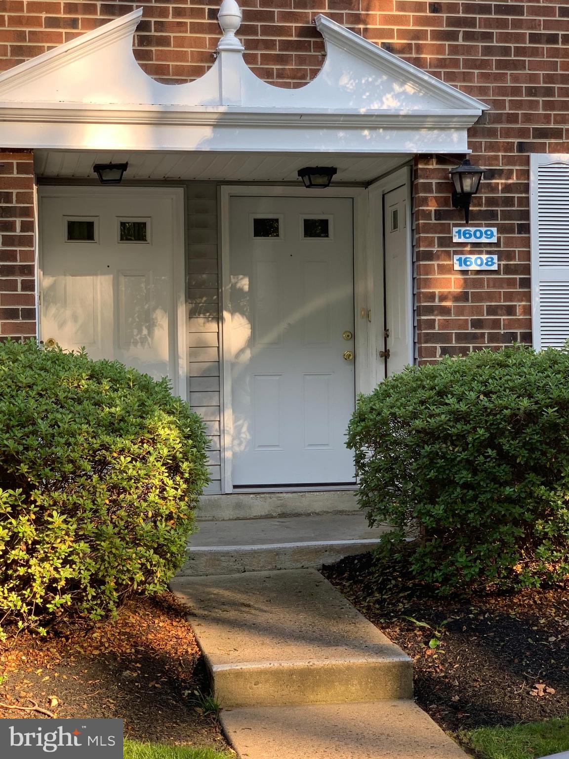 1609 Huntingdon Mews Clementon, NJ 08021 - Photo 1 of 15 a front view of a house with a yard