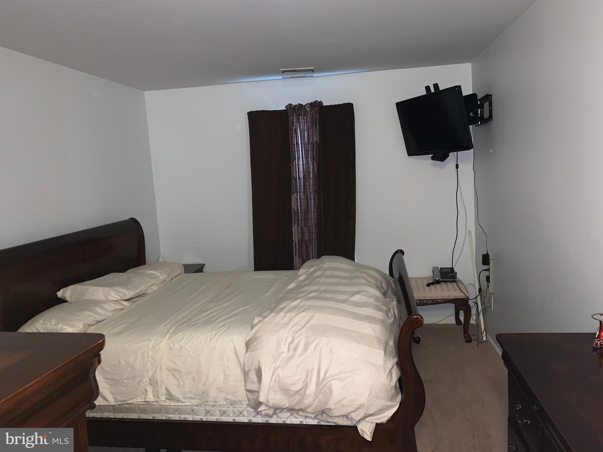 1609 Huntingdon Mews Clementon, NJ 08021 - Photo 12 of 15 a bedroom with a bed and two chairs