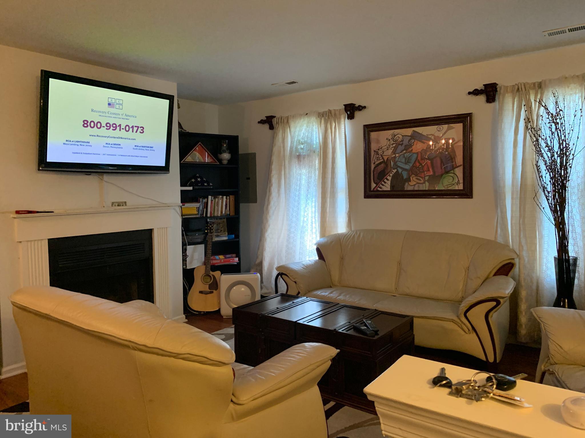 1609 Huntingdon Mews Clementon, NJ 08021 - Photo 3 of 15 a living room with furniture and a fireplace