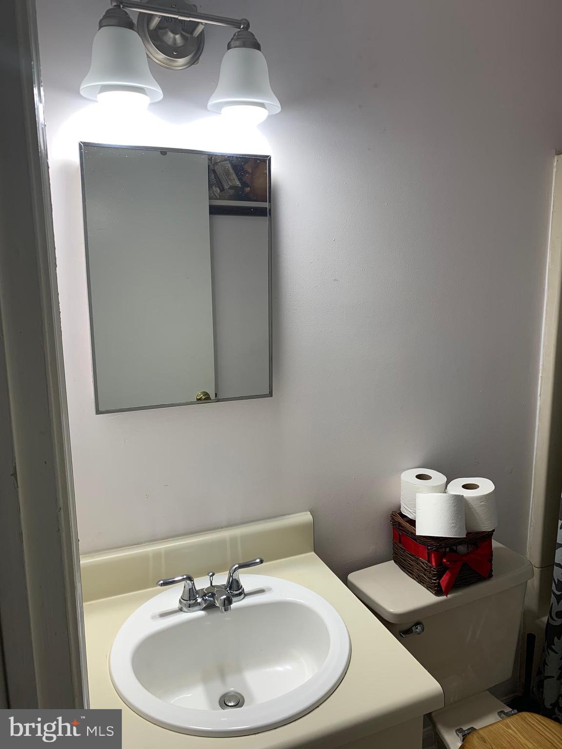 1609 Huntingdon Mews Clementon, NJ 08021 - Photo 9 of 15 a bathroom with a sink and a mirror