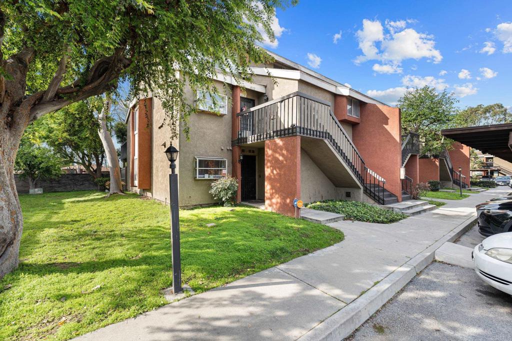 6830 Alondra Boulevard Paramount, CA 90723 - Photo 1 of 1 a view of a house with a yard