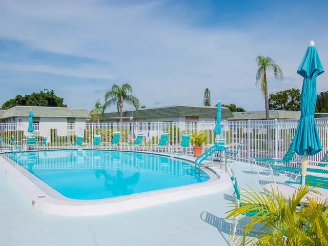 a view of a swimming pool with a patio