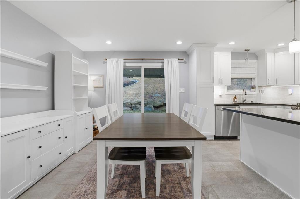 103 Tree View Drive Coraopolis, PA 15108 - Photo 12 of 48 a kitchen with granite countertop a stove and white cabinets