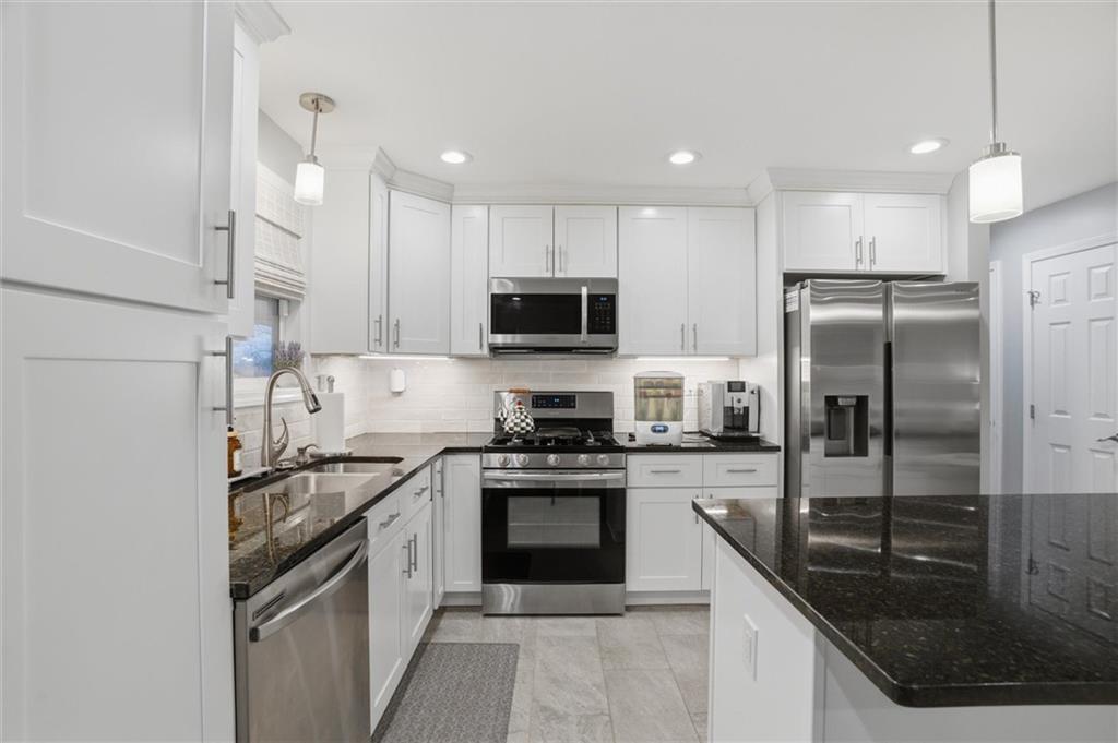 103 Tree View Drive Coraopolis, PA 15108 - Photo 19 of 48 a kitchen with a sink a stove a refrigerator and a sink