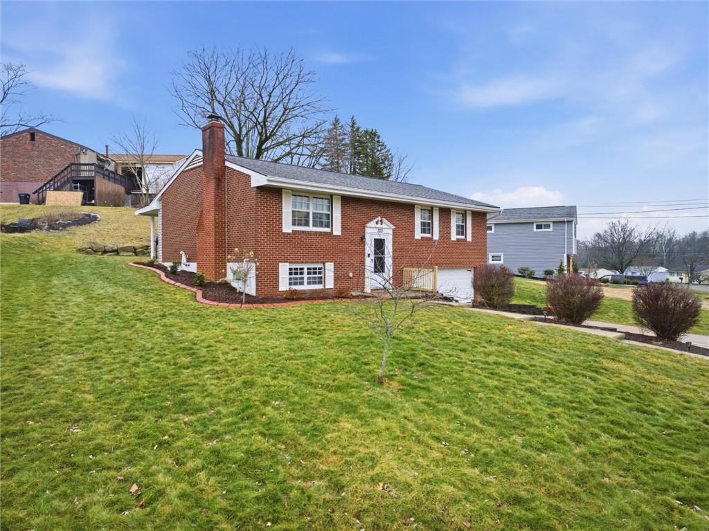 103 Tree View Drive Coraopolis, PA 15108 - Photo 2 of 48 a house view with a garden space