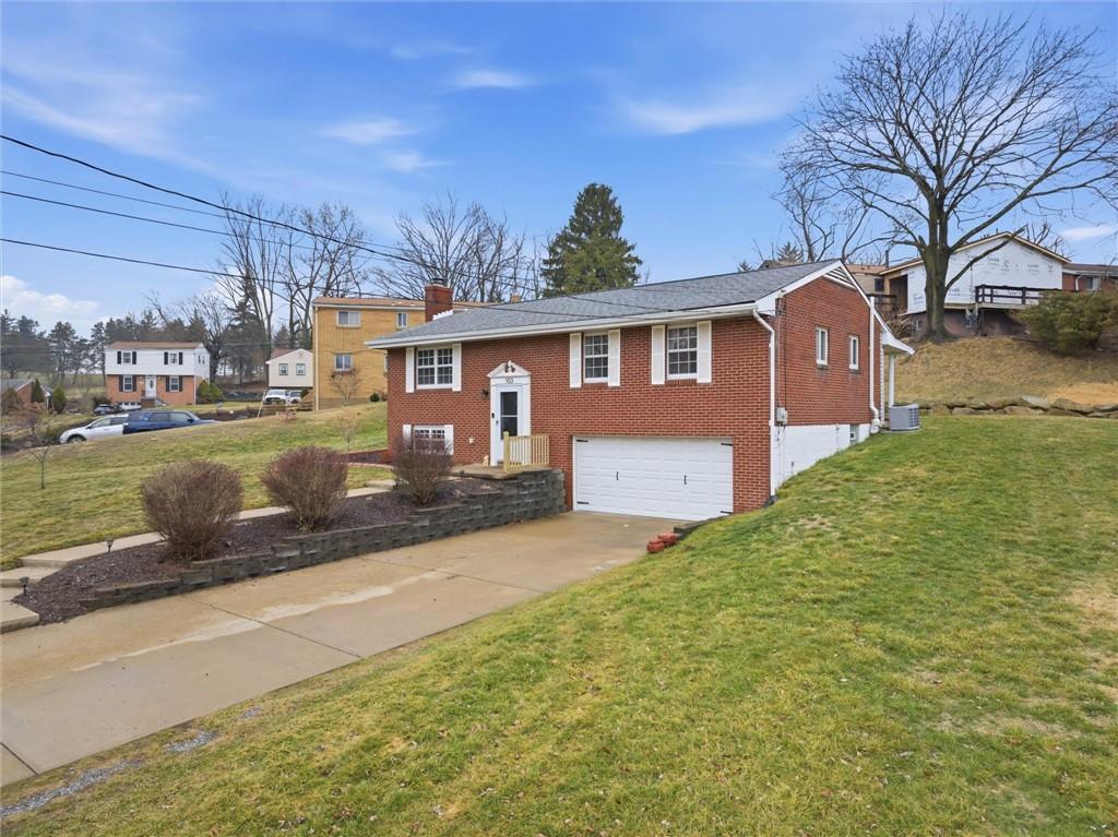103 Tree View Drive Coraopolis, PA 15108 - Photo 3 of 48 a front view of a house with a yard