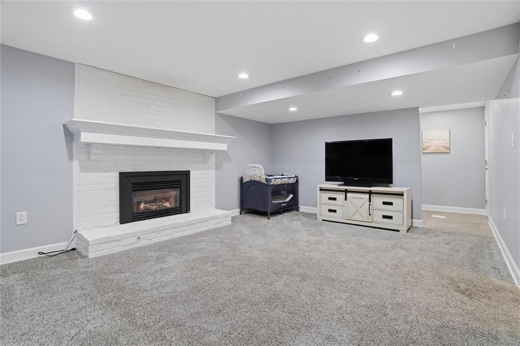 103 Tree View Drive Coraopolis, PA 15108 - Photo 33 of 48 a living room with furniture and a flat screen tv