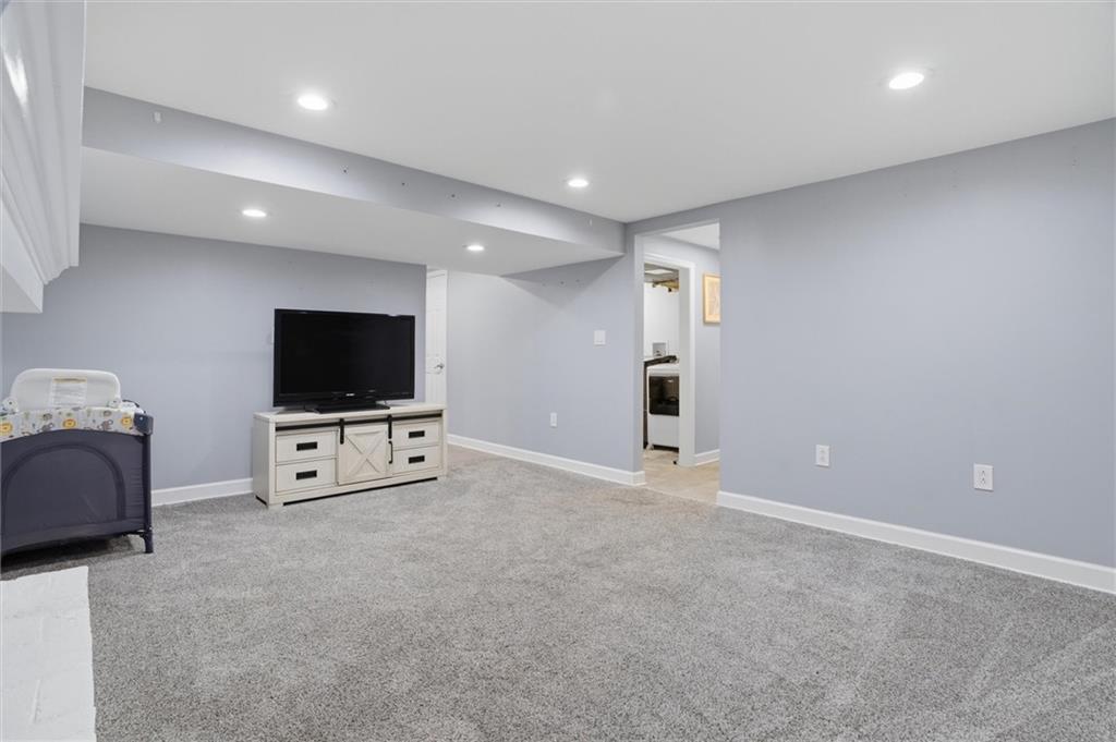 103 Tree View Drive Coraopolis, PA 15108 - Photo 36 of 48 a living room with furniture and a flat screen tv