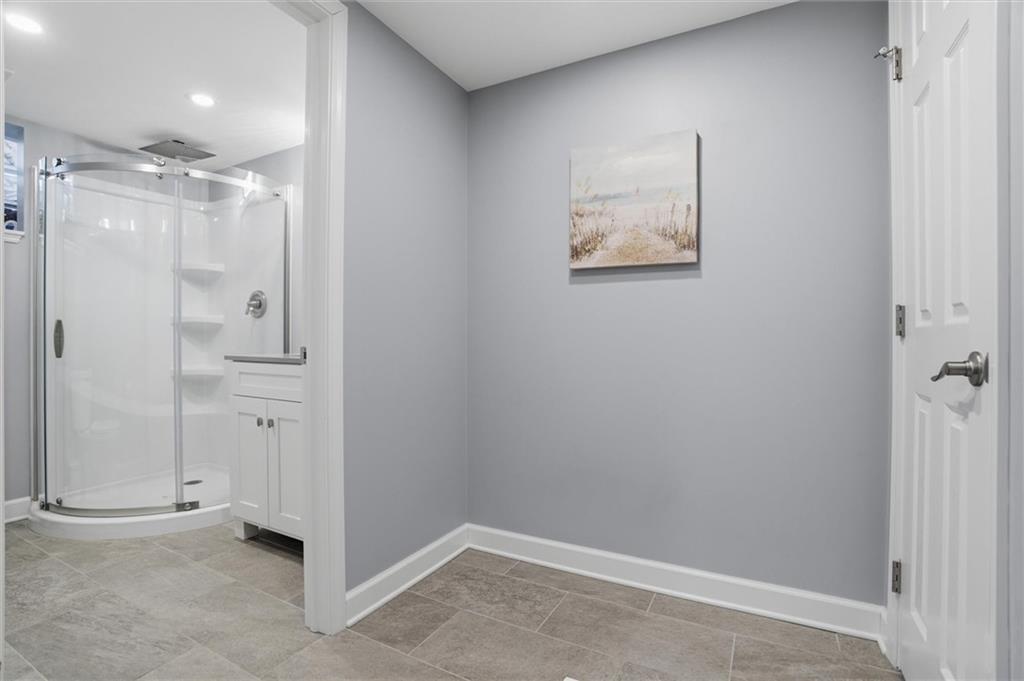 103 Tree View Drive Coraopolis, PA 15108 - Photo 38 of 48 an empty room with wooden floor and mirror