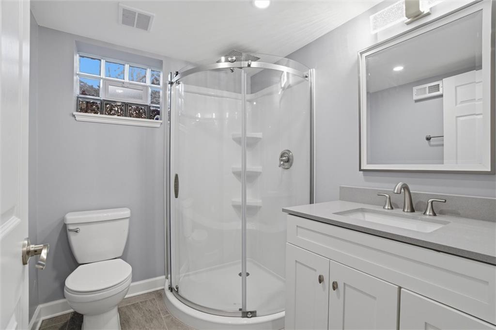 103 Tree View Drive Coraopolis, PA 15108 - Photo 39 of 48 a bathroom with a granite countertop sink toilet and shower