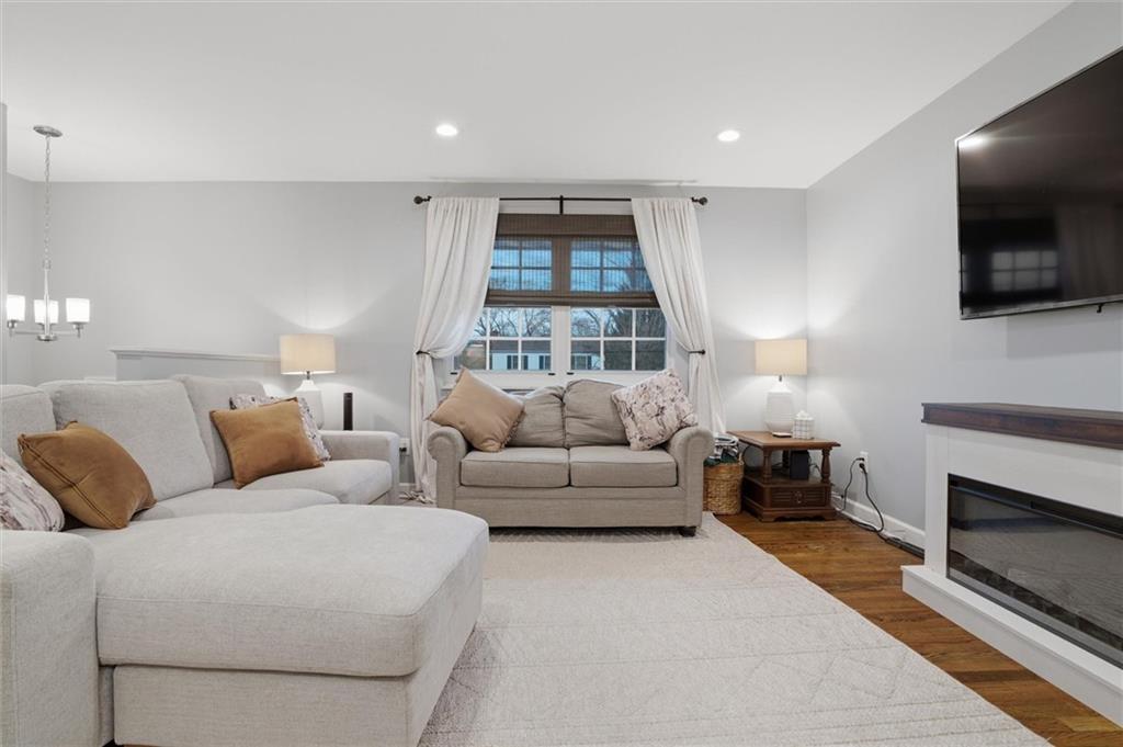 103 Tree View Drive Coraopolis, PA 15108 - Photo 6 of 48 a living room with furniture a flat screen tv and a fireplace