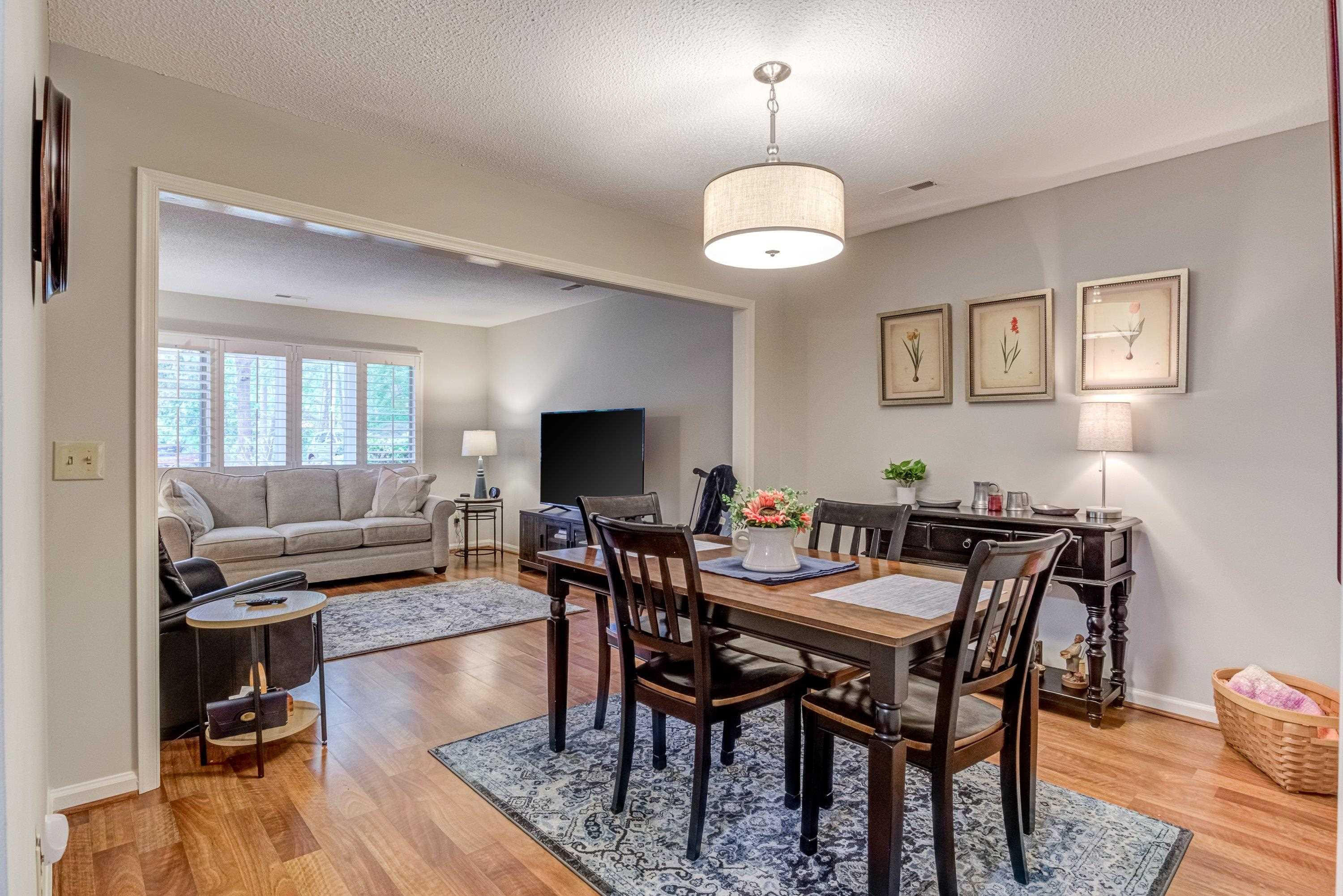 705 Tan Tara Square Raleigh, NC 27615 - Photo 12 of 31 a view of a dining room with furniture
