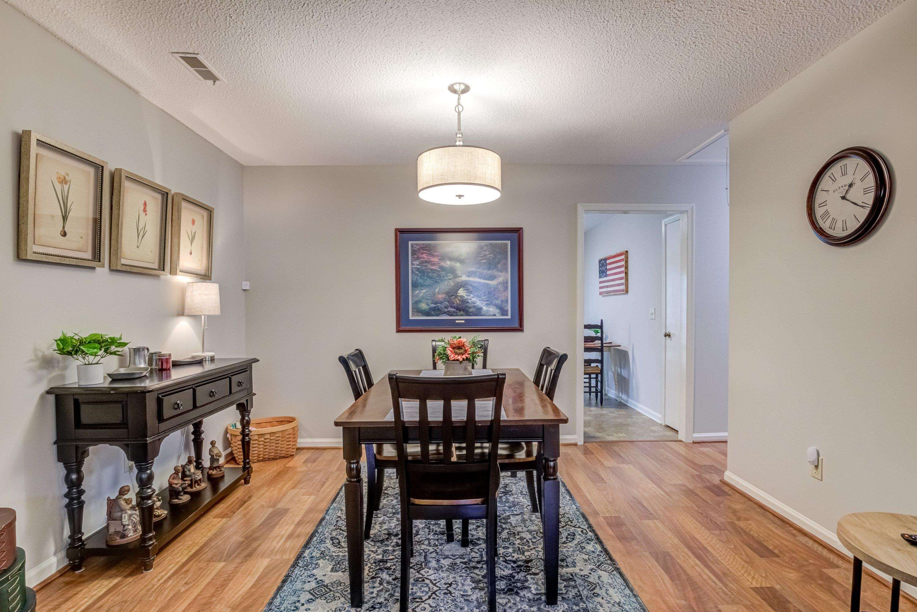 705 Tan Tara Square Raleigh, NC 27615 - Photo 13 of 31 a view of a dining room with furniture and wooden floor