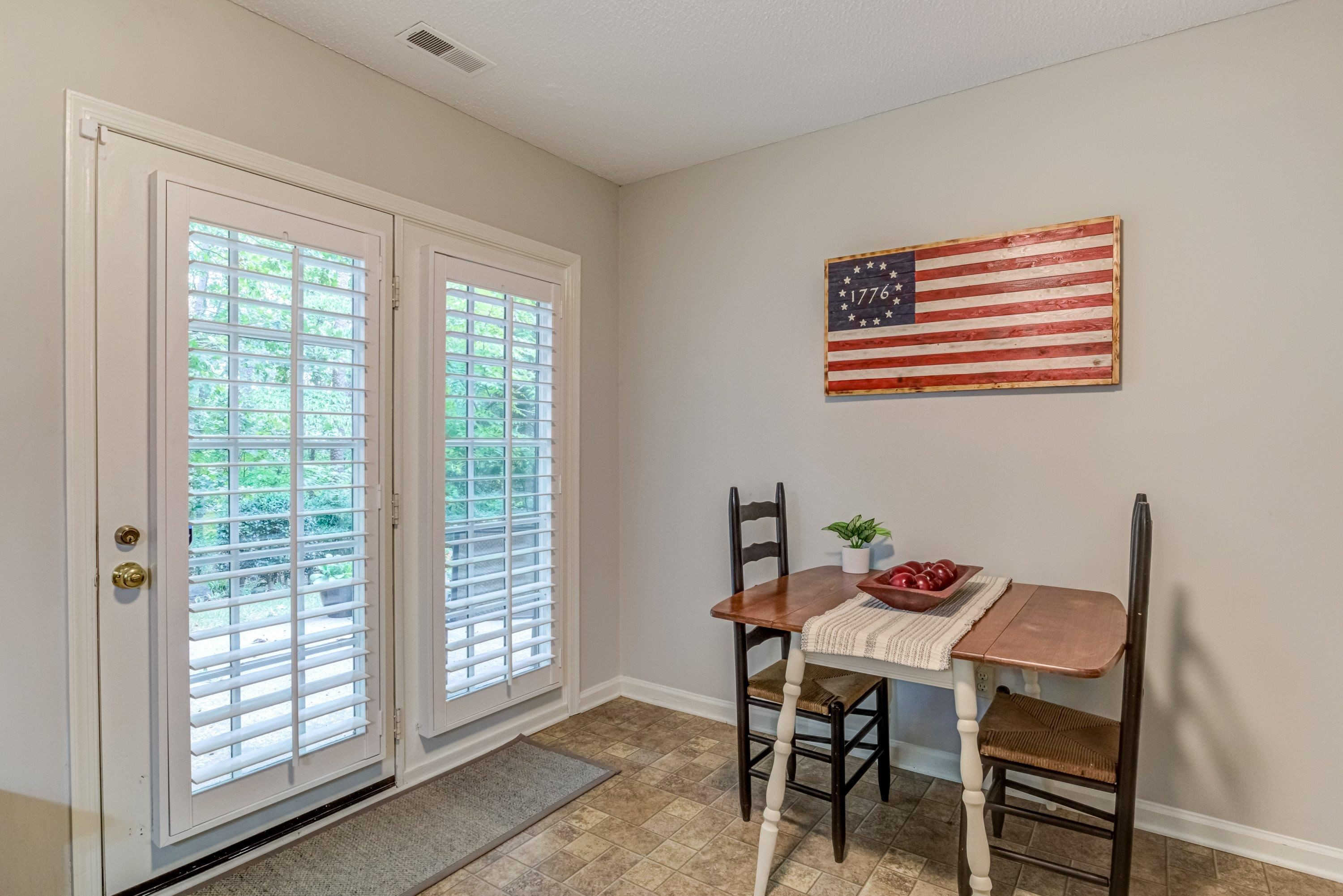 705 Tan Tara Square Raleigh, NC 27615 - Photo 15 of 31 a dining room with furniture and window