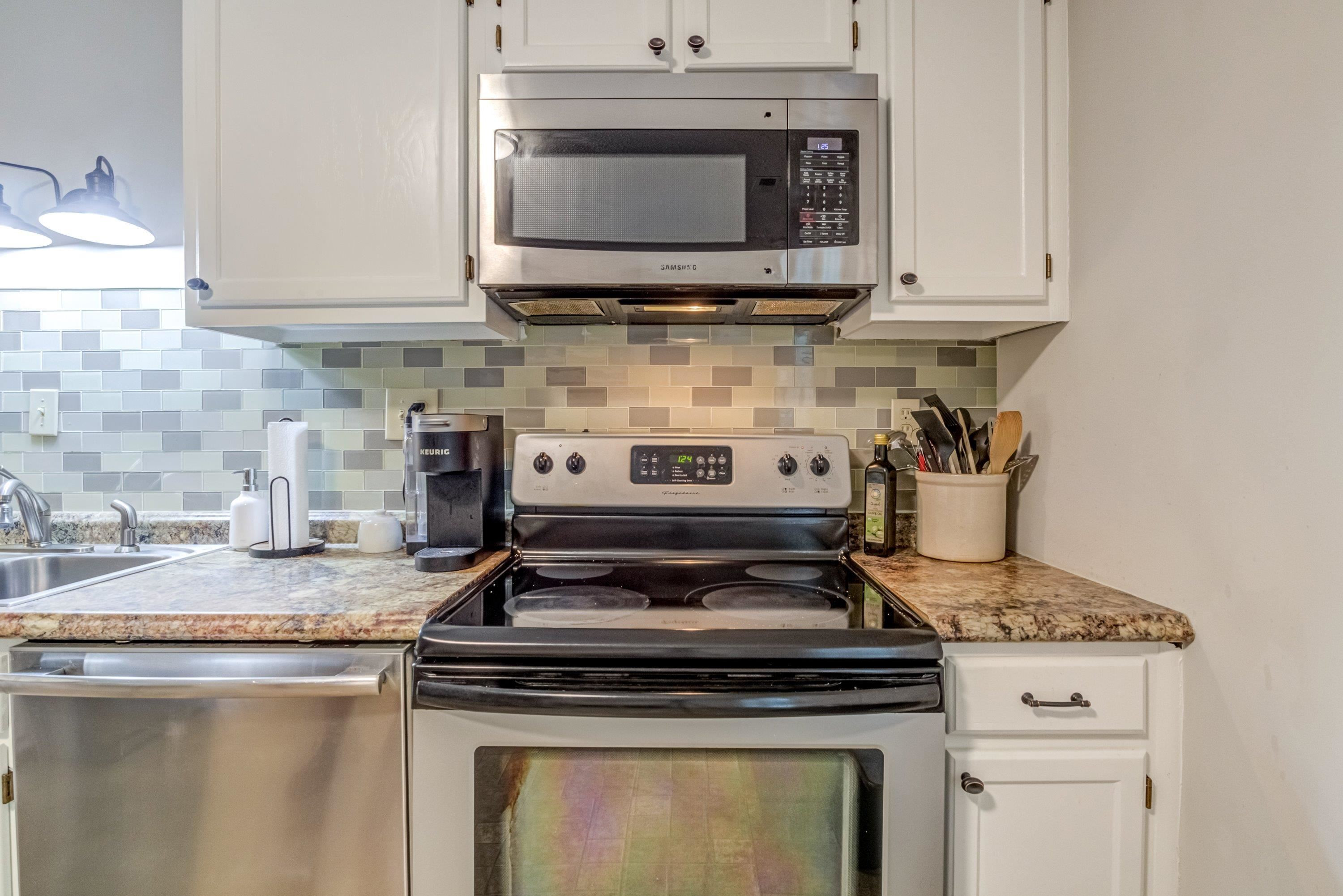 705 Tan Tara Square Raleigh, NC 27615 - Photo 18 of 31 a stove top oven sitting inside of a kitchen