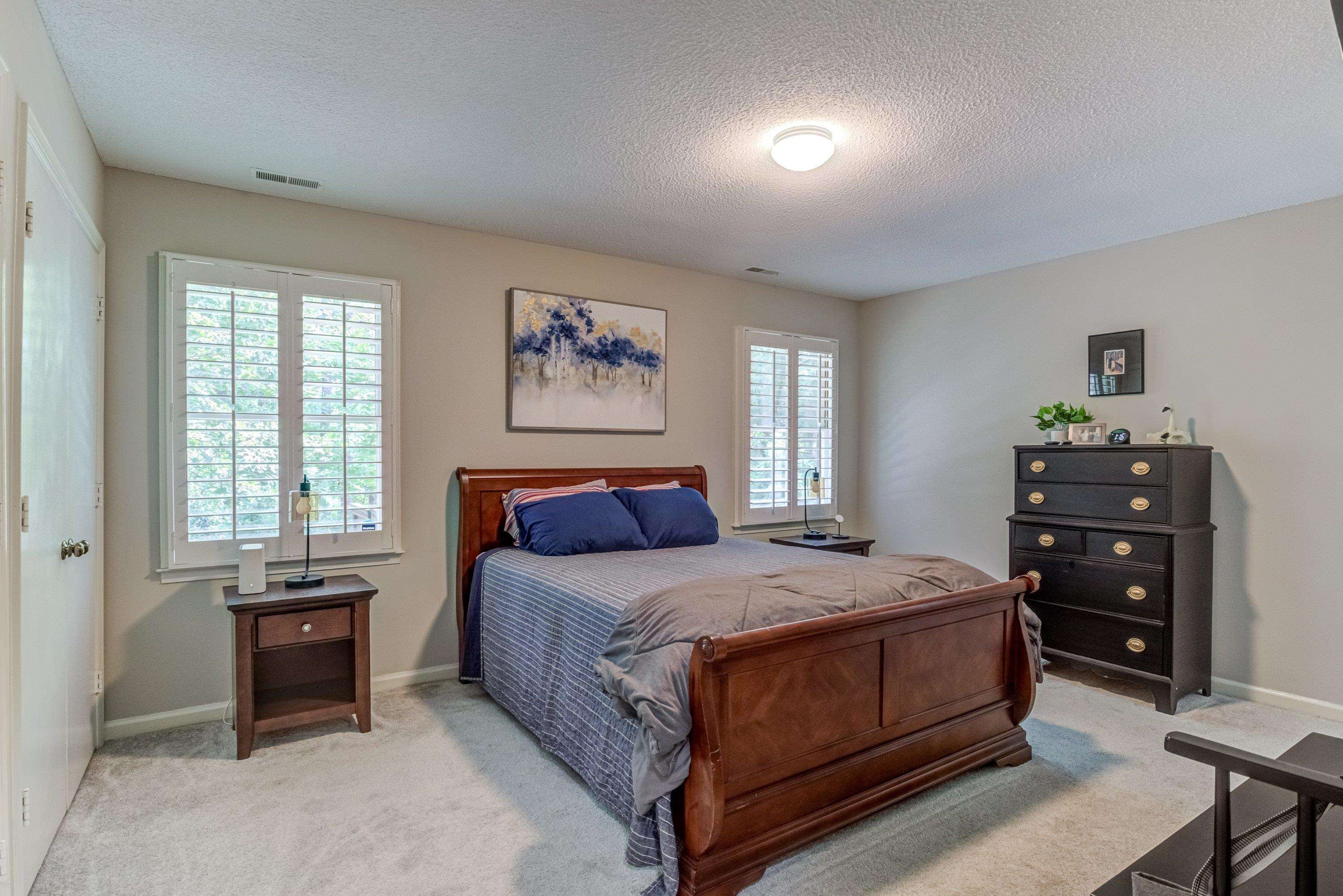 705 Tan Tara Square Raleigh, NC 27615 - Photo 20 of 31 a bedroom with a bed and a closet